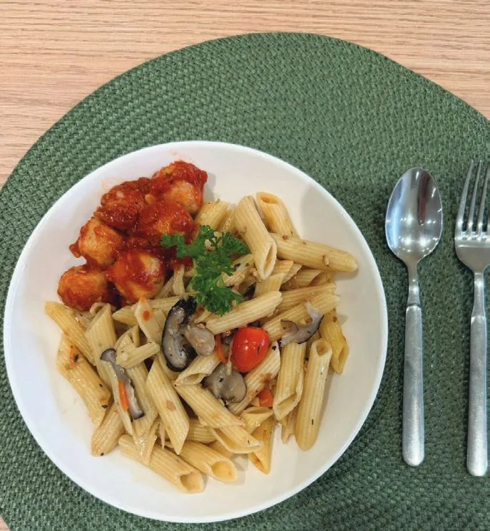 A TITAN lunch of penne with mushrooms and tomato, served with sweet and sour chicken