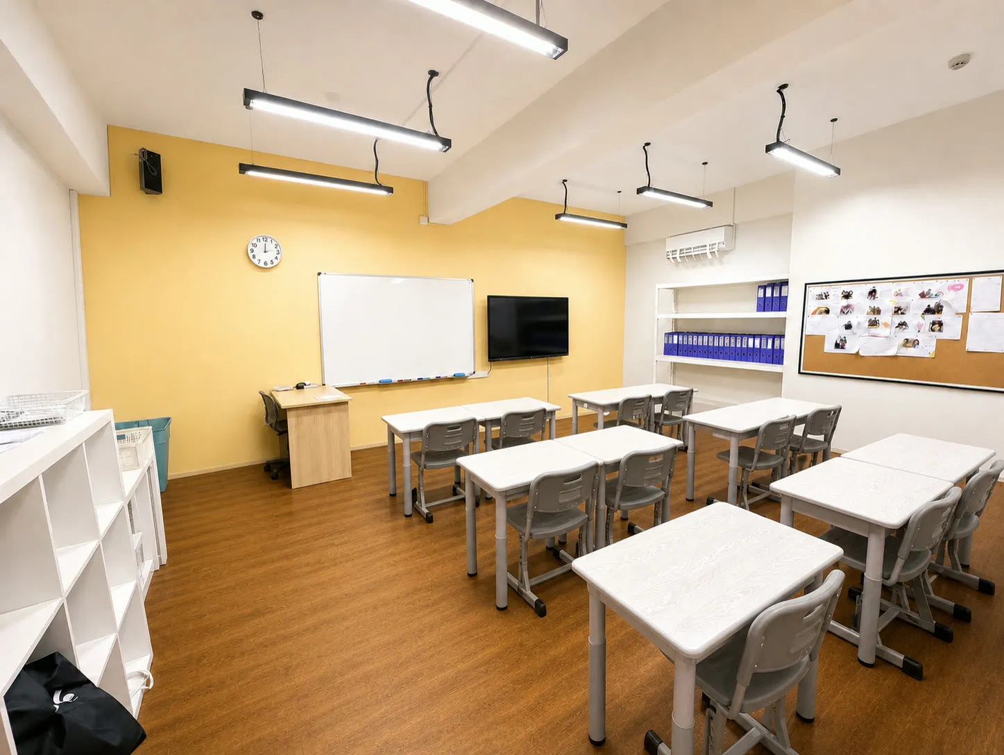 A classroom at the TITAN Taman Molek campus, with desks facing a whiteboard